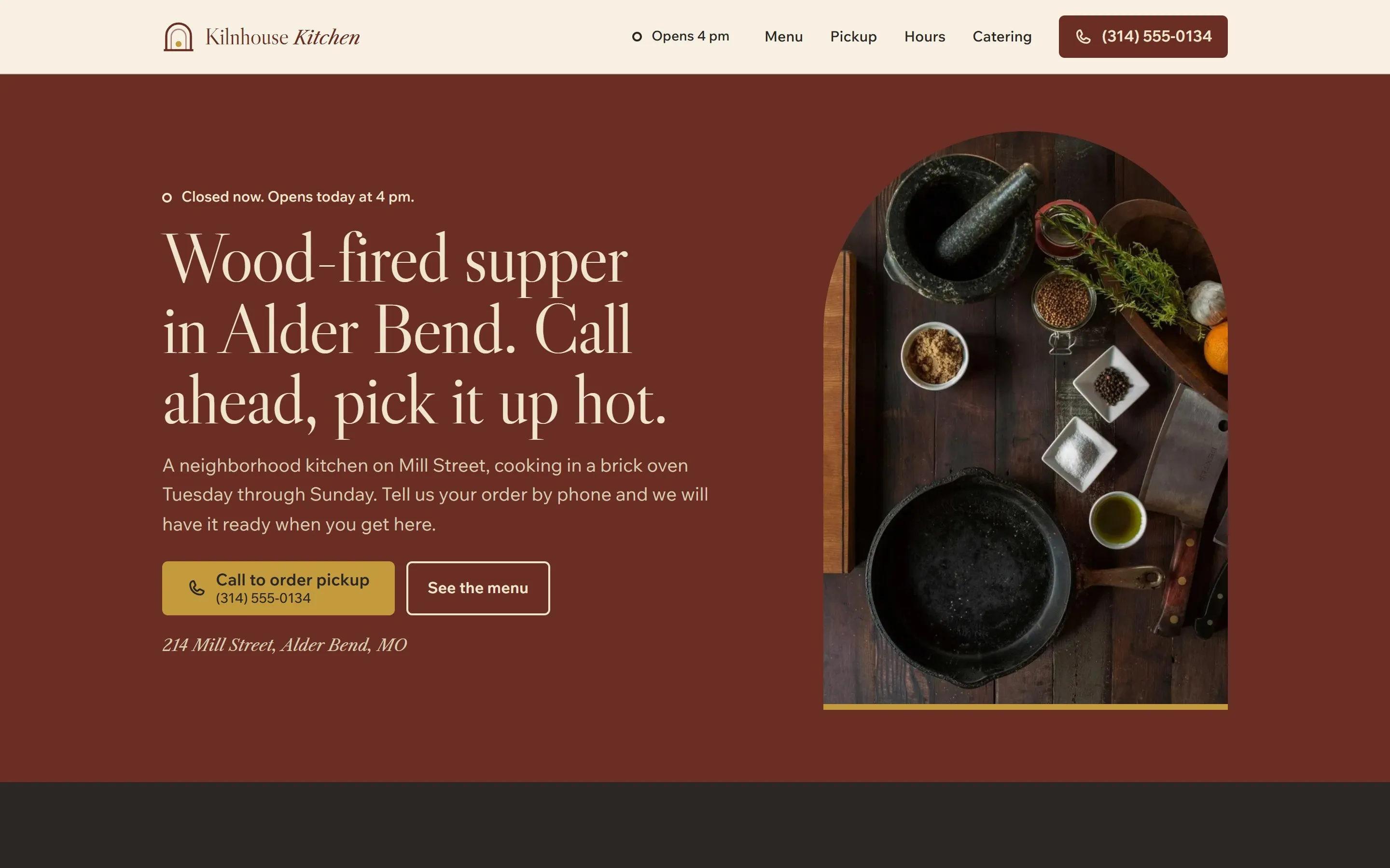 Home page of the Kilnhouse Kitchen sample site: the headline “Wood-fired supper in Alder Bend. Call ahead, pick it up hot.” on brick red beside an arched kitchen photo.